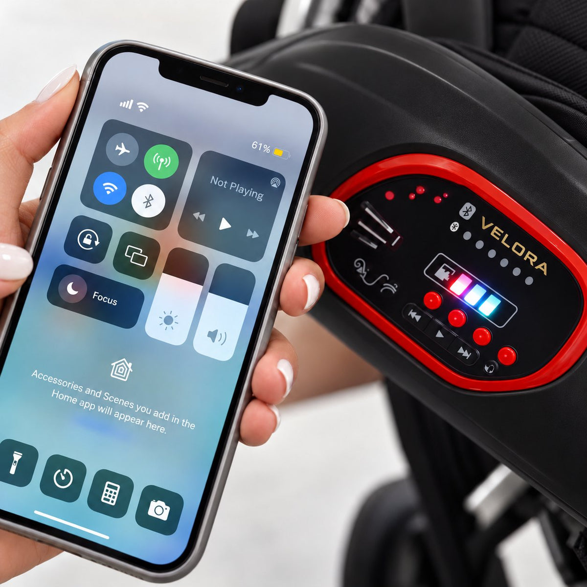 Bluetooth music console with separate music buttons on the Black VELORA stroller
