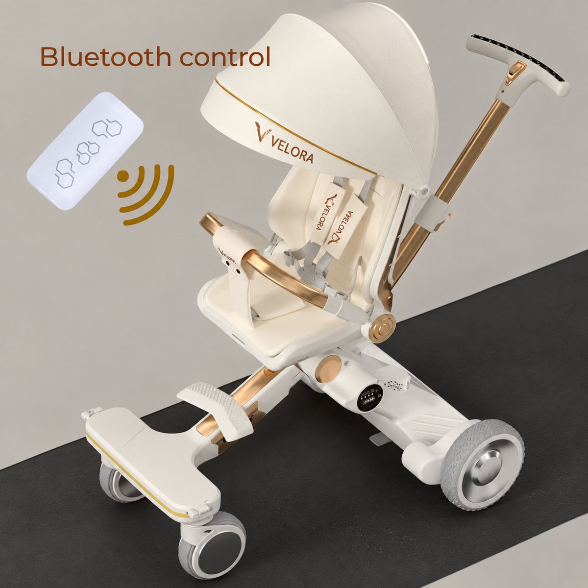 Serenade beige-and-gold VELORA stroller with its remote control for the electric movement